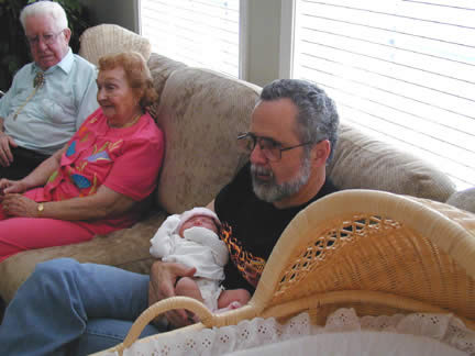 Grandpa with Rhiannon..Great-Grandpa & Evelyn looking on